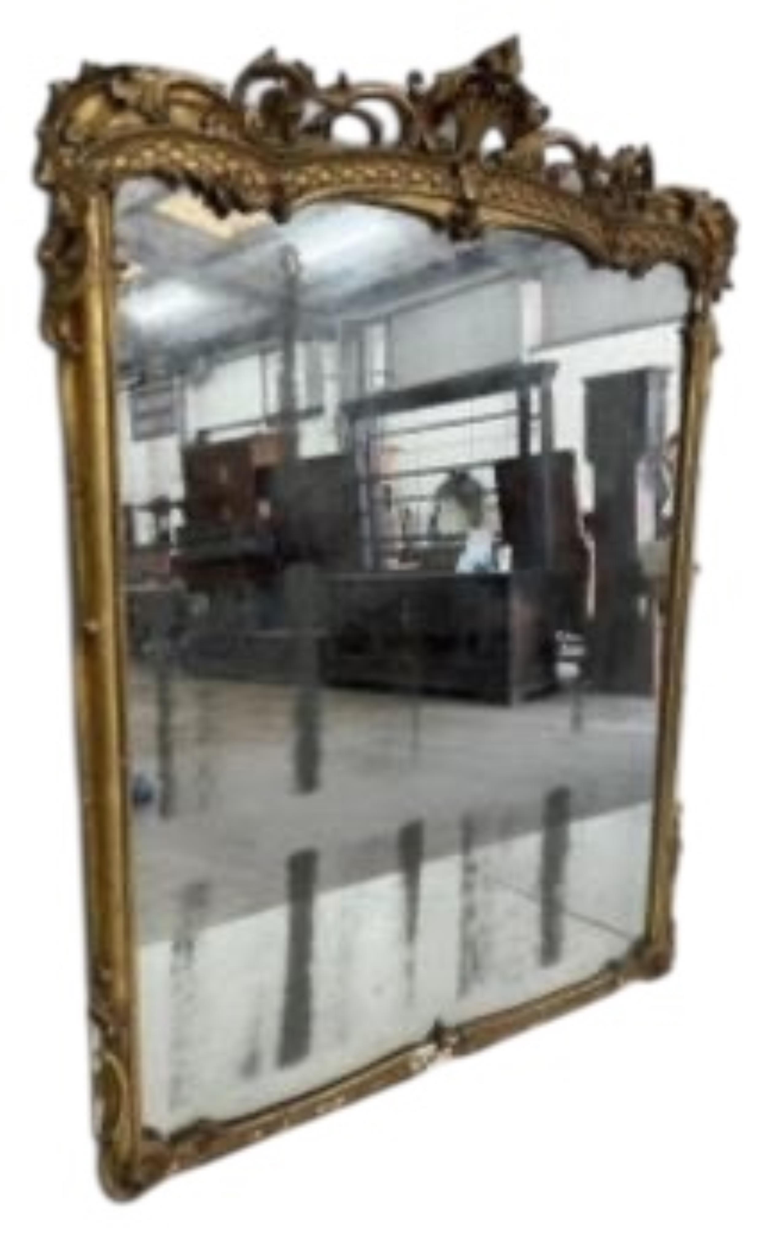 A Victorian carved giltwood and composition marble topped serpentine console table and mirror, width 132cm, height 177cm.